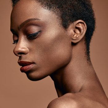 monochromatic portrait of black woman against chocolate colored background